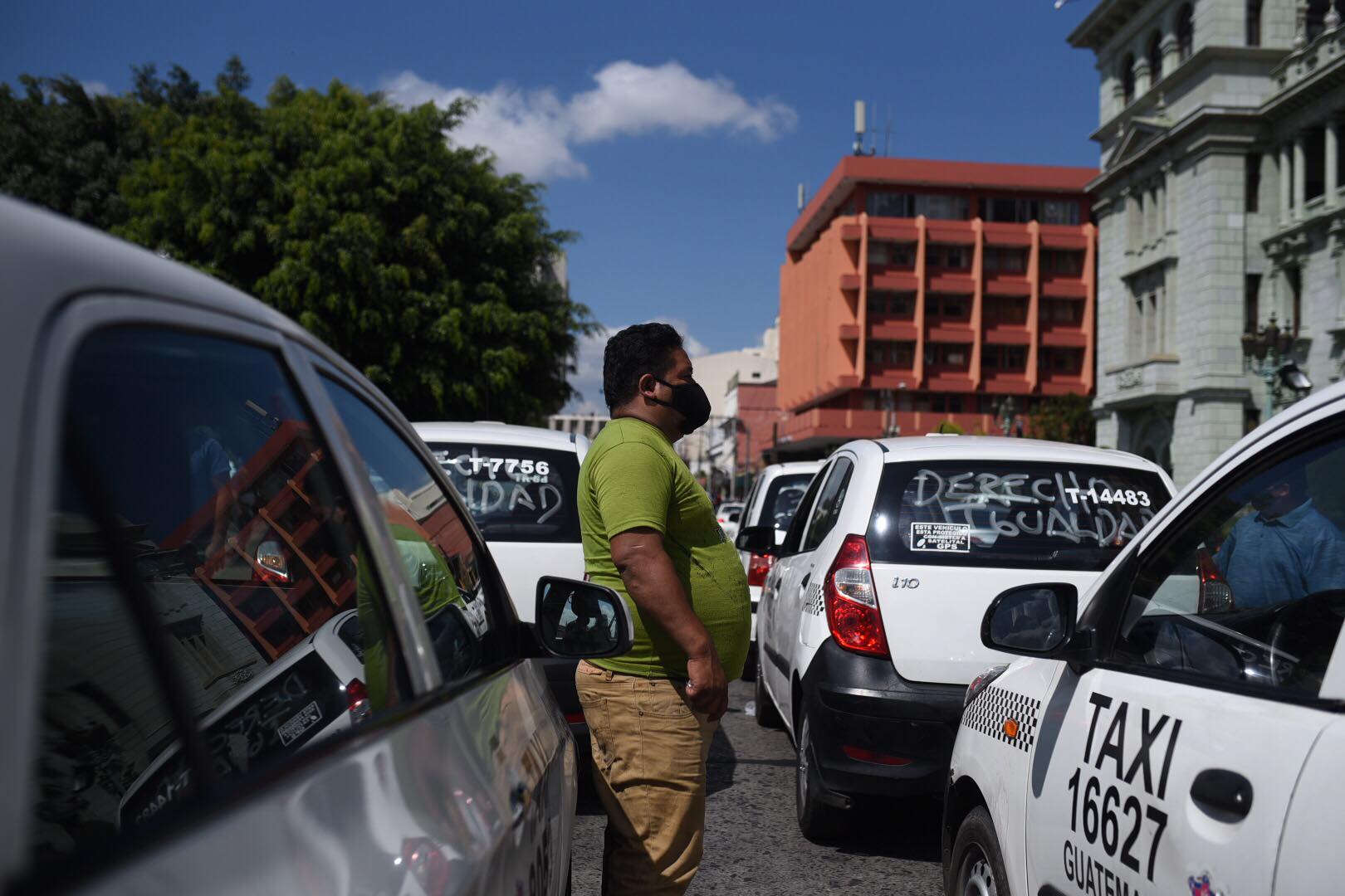 manifestación de taxistas contra pago de seguro en zona 1