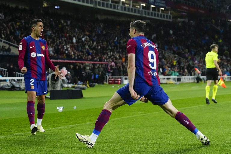 BARCELONA, 29/04/2024.- Los jugadores del FC Barcelona, el polaco Robert Lewandowski (d) y el portugués Joao Cancelo, celebran el tercer gol del equipo valencianista durante el partido de la jornada 33 de Liga en Primera División que FC Barcelona y Valencia CF disputan este lunes en el Estadio Olímpico Lluis Companys. EFE/Enric Fontcuberta.